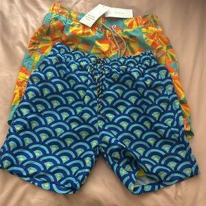 2 pair brand new swim trunks.  Size xs or size 10 boys.
